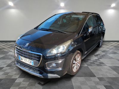 the small black car is parked in a large room