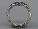 an image of a silver ring with a diamond in the center