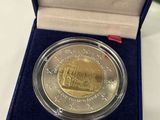 a close up of a coin in a box on a table