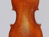 an antique violin with a wooden back and bow