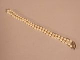 a white pearl bracelet with a silver clasp