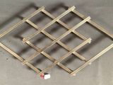 a picture of a wine rack made out of wood