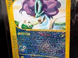 a close up of a pokemon card on a table