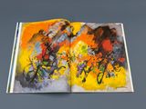 an open book with a picture of a man riding a bike