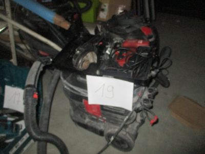an image of a car engine with a sign attached to it