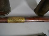 two different types of brass pipes on a table