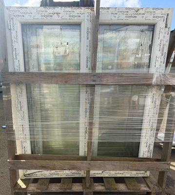 a wooden pallet that has some old windows on it