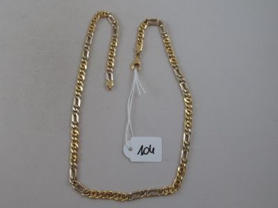 a close up of a gold chain with a price tag on it