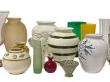 many different types of vases and vases on the table