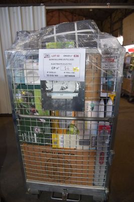 a metal cart with a sign on it in a warehouse