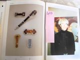 an open book with a picture of a woman and a pen