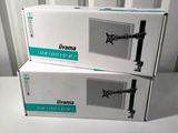 two boxes of tvs sitting on top of a white table