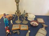 a table with a blue table cloth and various items on it