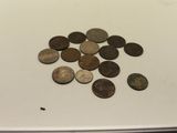 a lot of coins that are on the table