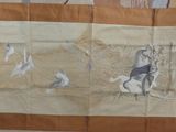 une photo d'une tapisserie représentant un homme à cheval