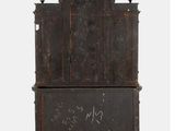 an old wooden cabinet with writing on the front of it