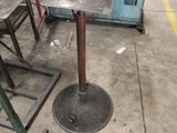 a machine that is sitting on the ground next to some chairs