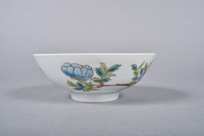 chinese porcelain bowl with blue flowers and leaves on a white background