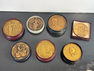 a lot of coins that are sitting on a table