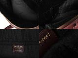 a close up of a purse with a tag on it