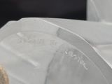 a teddy bear that is sitting in a plastic container