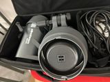 a suitcase with a pair of headphones and a hair dryer