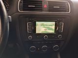 the dashboard of a car with a gps device in the center of it