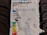 a close up of a car tire with a sticker on it