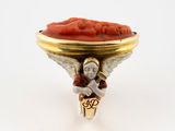 an image of a ring with an angel holding a bowl of food