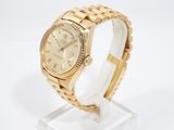 an image of a gold rolex watch on a white background