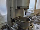 a mixer sitting on a counter in a kitchen