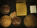 a display case with a variety of medals in it