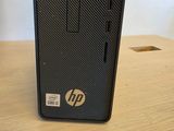 a close up of a desktop computer sitting on a wooden table