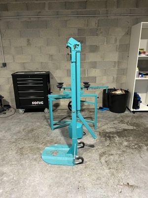 an image of a blue machine in a garage