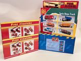 three boxes of fire fighters and a fire truck