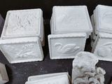 a lot of white cement blocks sitting on a table