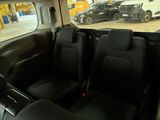 a view of the inside of a car from the driver ' s seat