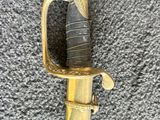 an image of a sword with a handle on a carpet