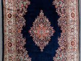tapis persan ancien à motif de médaillon sur fond bleu