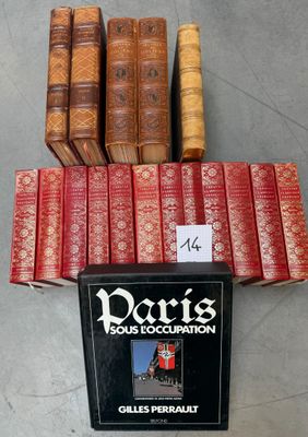 a stack of books sitting on top of a table next to each other
