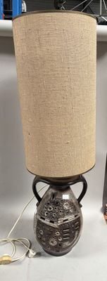 a lamp that is sitting on a table next to a book