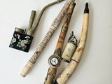 three different types of pipes and a lighter on a table