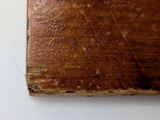 a small piece of wood that has been cut in half