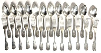 a lot of silver spoons and forks on the table
