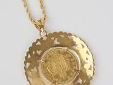 an image of a gold coin on a gold chain