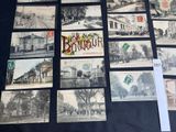 many old postcards on display on a table