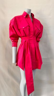 a woman ' s pink shirt dress on a mannequin mannequin mannequin mannequin mannequin mannequin mannequin manne