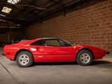 a red sports car parked in a garage