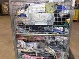 a metal cart with many items in it in a warehouse