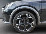 a close up of a car ' s wheel on the street